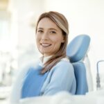 woman in dental chair considering Stillwater Dentistry for her family dental care
