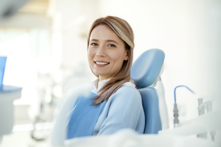 woman in dental chair considering Stillwater Dentistry for her family dental care