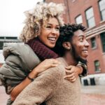 smiling couple in fall dental tips