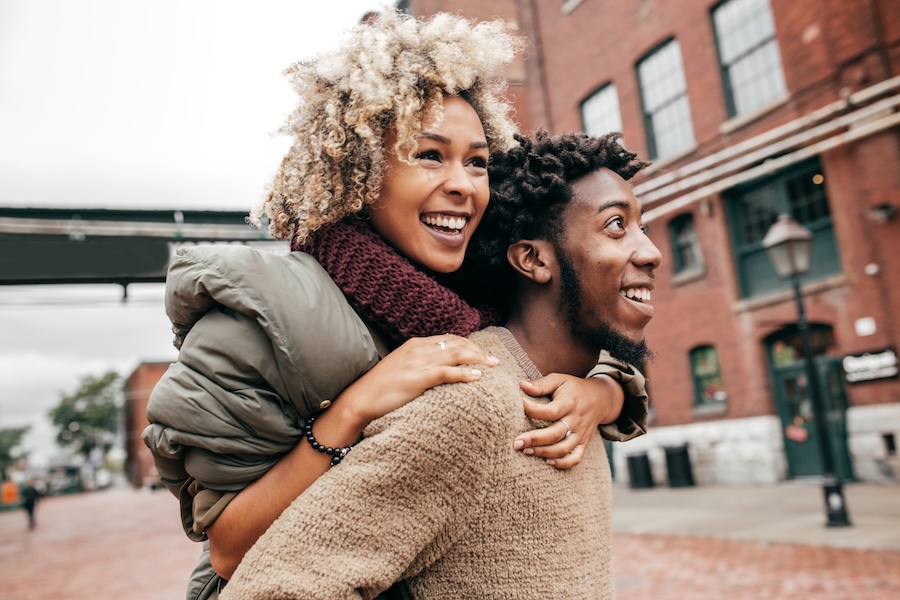 smiling couple in fall dental tips