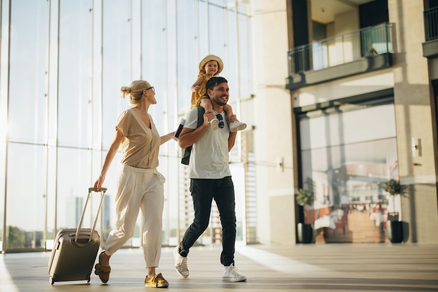 family traveling after scheduling a dental visit before summer vacation