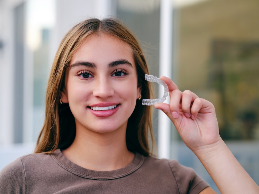 teen with invisalign clear aligners for braces